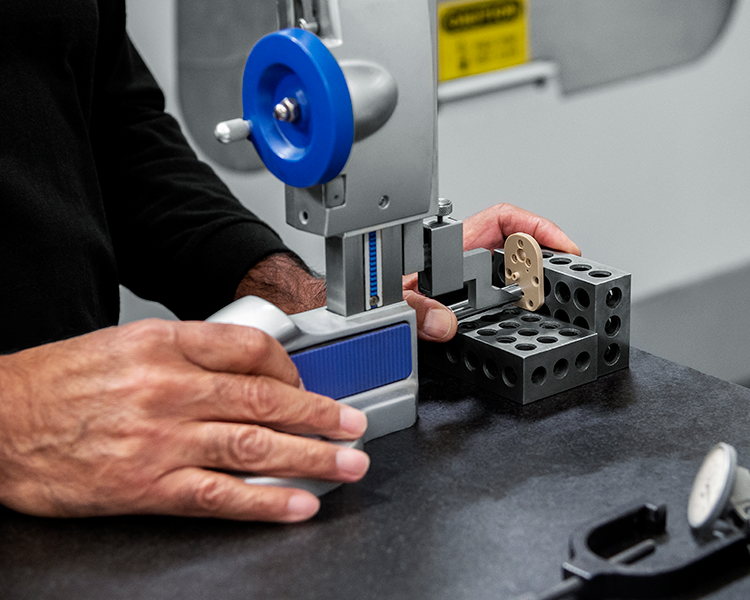 Machined parts being inspected